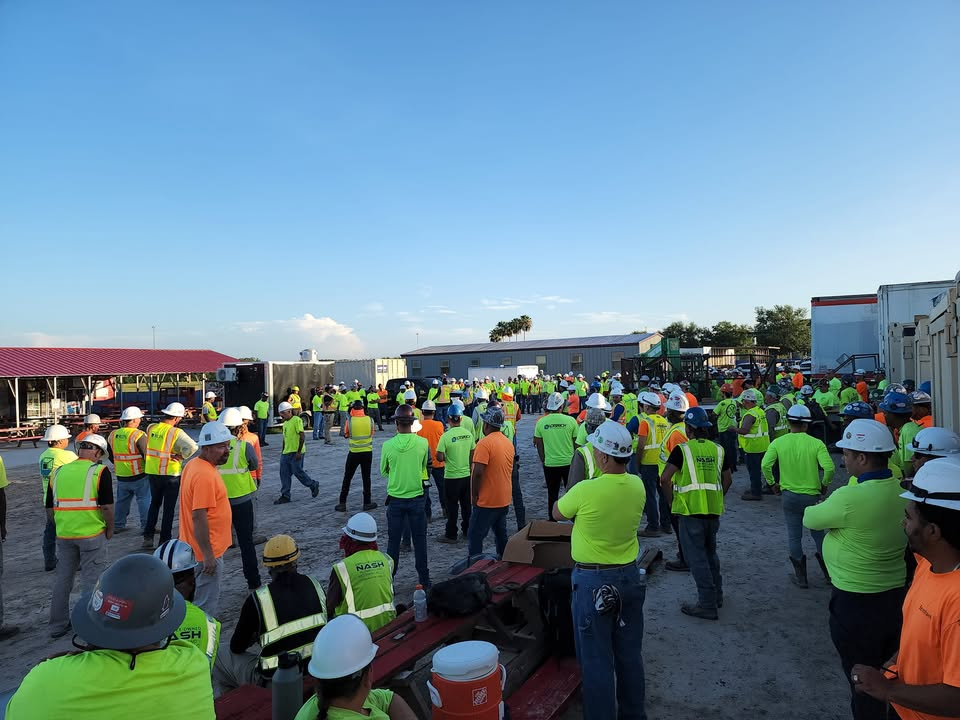 Danger Systems field activity with a construction crew gathered for a site briefing